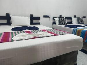 Ένα ή περισσότερα κρεβάτια σε δωμάτιο στο Yashi's Place Sigiriya