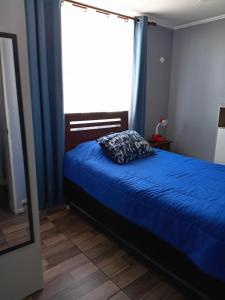 Giường trong phòng chung tại Condominio Mistral Oriente 2