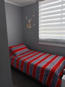 Giường trong phòng chung tại Condominio Mistral Oriente 2 +7 ảnh