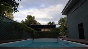 a small swimming pool in the backyard of a house at Nani House in Montezuma +4 photos