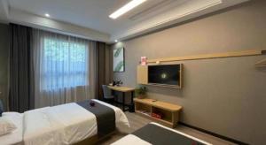 a hotel room with a bed and a desk at Thank Inn Jiangsu Suqian Sucheng District Car Town in Suqian +23 photos