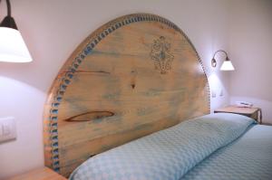 En eller flere senge i et værelse på Alghero Vacanze Hotel