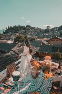 Gambar di galeri bagi Lijiang Hearing Flowers Hall Flowerless B&B di Lijiang +9 gambar