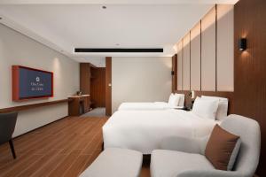TV tai viihdekeskus majoituspaikassa 滨江万璟酒店 One Gem Hotel
