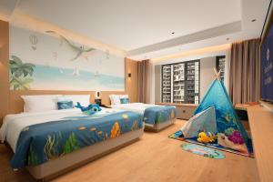 Vuode tai vuoteita majoituspaikassa 滨江万璟酒店 One Gem Hotel