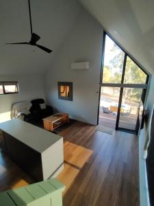 an empty living room with a couch and a large window at Valley Views Retreat in Richmond