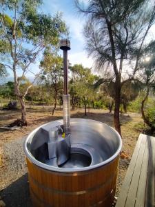a barrel hot tub with a fountain in a park at Valley Views Retreat in Richmond