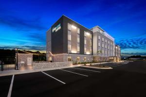 a rendering of a hotel with a parking lot at Everhome Suites Fayetteville near Fort Bragg in Fayetteville