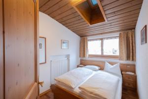Postel nebo postele na pokoji v ubytování Residence Salvan