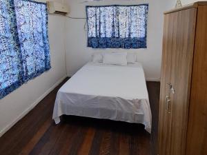 Katil atau katil-katil dalam bilik di Samoa Home