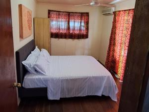Katil atau katil-katil dalam bilik di Samoa Home