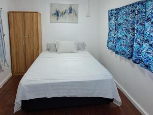 Katil atau katil-katil dalam bilik di Samoa Home