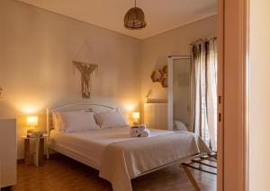 Ένα ή περισσότερα κρεβάτια σε δωμάτιο στο Alimar Apartment