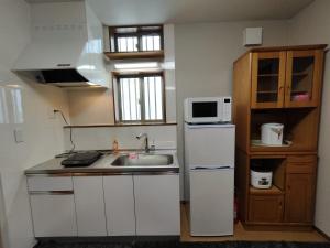 Kuchyň nebo kuchyňský kout v ubytování BBQ 夏季プール マッサージチェア 舞子スノーリゾート 加賀屋旅館 南魚沼 Kagaya Ryokan 加贺屋旅馆