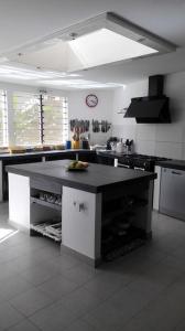 a kitchen with a large island in the middle at Villa Maria in Cap Skirring +22 photos