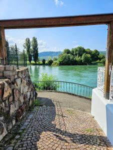 a view of a river from a bridge at Suite Kelnhof Patio - Cozy Riverside Apartment in Küssaberg