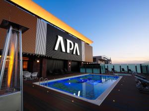 a swimming pool on the roof of a building at APA Hotel & Resort Osaka Namba Ekimae Tower in Osaka