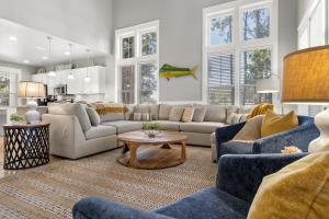 a living room with couches and a table at 1369 Laurel Grove "The Crows Nest" in Destin