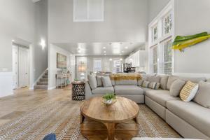 a living room with a couch and a table at 1369 Laurel Grove "The Crows Nest" in Destin