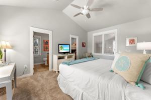 a bedroom with a bed with a ceiling fan at 1369 Laurel Grove "The Crows Nest" in Destin