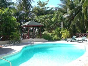 a swimming pool with a gazebo and a gazebo at The Legend Garden Condos in Saint Peter