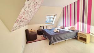 a bedroom with a bed with two stuffed animals on it at VILLA CASSIA w Rabce przy Parku Zdrojowym - smaczne śniadania i obiady in Rabka-Zdrój