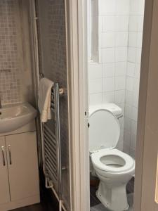 a bathroom with a toilet and a sink at Gloucester Haven Retreat in Gloucester +24 photos