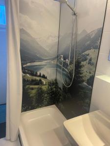 a bathroom with a shower with a view of a mountain at Haus Anna-Marie in Feldberg +26 photos