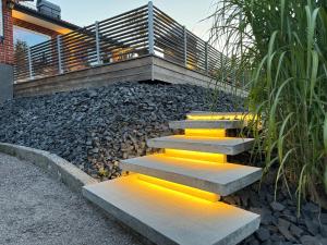 a set of stairs with yellow lights on them at Villa Valjensa in Sölvesborg