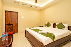 Postel nebo postele na pokoji v ubytování Hotel Ramleela
