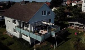 an overhead view of a house with a balcony at Sonnenblick Apartment sunview #rain-shower 2P bathtube BIG kitchen in Menden