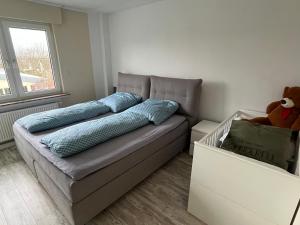 a couch with pillows on it in a room at Sonnenblick Apartment sunview #rain-shower 2P bathtube BIG kitchen in Menden