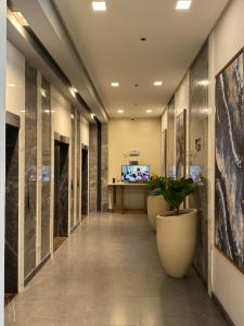 Телевізор і / або розважальний центр в MBMJs Condo ONE Regis
