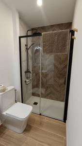 a bathroom with a shower and a toilet in it at Casa rural La Pinada in Villanueva de Viver +19 photos