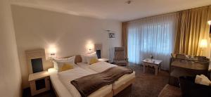 Postel nebo postele na pokoji v ubytování Hotel Restaurant Waldsägmühle