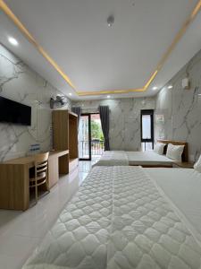 Postel nebo postele na pokoji v ubytování EaKao Motel