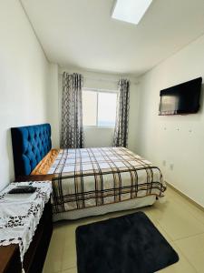 Ένα ή περισσότερα κρεβάτια σε δωμάτιο στο Mirante do mar