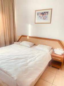 Postel nebo postele na pokoji v ubytování Agora Boutique Apart Hotel