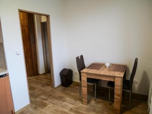 a dining room with a table and chairs at Apartmánový byt Kristýna in Nový Hrozenkov