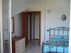 En eller flere senge i et værelse på Appartamento Tra Mare E Lago