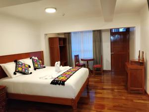Letto o letti in una camera di Kantu hotel