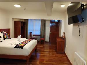 Letto o letti in una camera di Kantu hotel