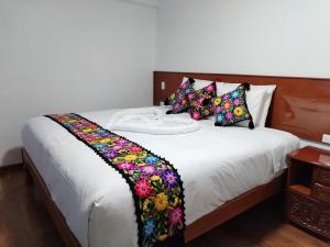 Letto o letti in una camera di Kantu hotel