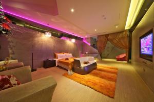 Postel nebo postele na pokoji v ubytování Han Guan Motel + 37 fotografií