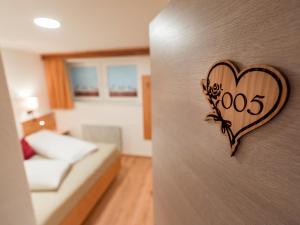 Krevet ili kreveti u jedinici u okviru objekta Hotel Ritterhof Ellmau