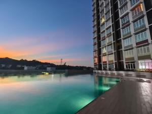 a large body of water in front of a building at LV7 Minimalist 4pax Kuantan in Kuantan