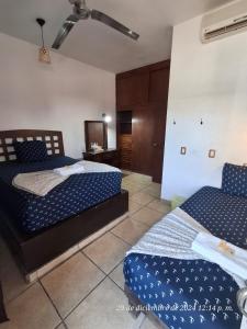 Postel nebo postele na pokoji v ubytování Hotel Colonos Los Cabos