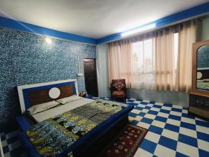 A bed or beds in a room at WHISPERING PINEs