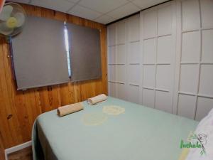 a small room with a table and a chalk board at Inchalá - Apartamento cerca del Puente Internacional General Artigas in Paysandú