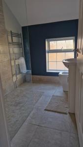a bathroom with a shower and a toilet and a sink at Yellow Stone Farm Lodge and Spa in Clonbrown +26 photos